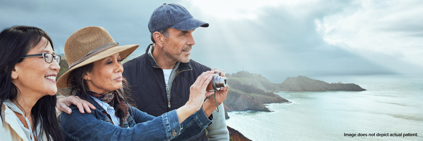 Family taking pictures of the lake